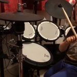 this little boy is a professional drummer