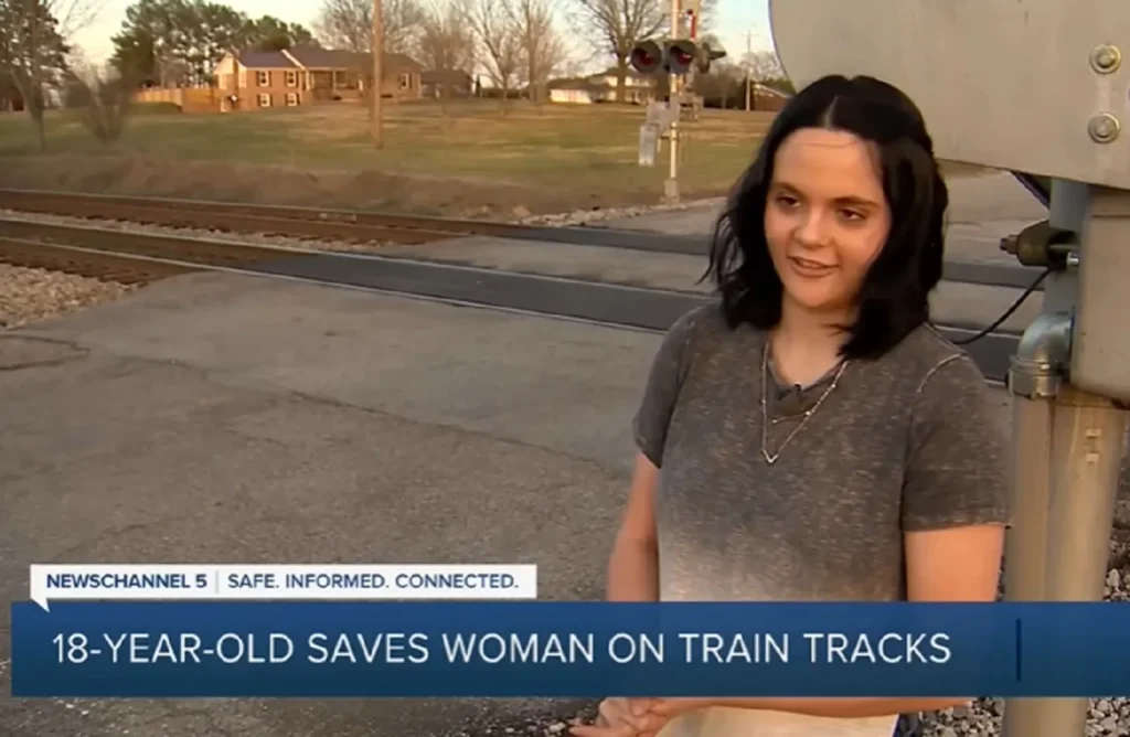 Tennessee railroad rescue, Heroic teen saves life, Elderly wheelchair rescue, Bravery on the tracks, Lifesaving quick actions, Train track heroism, Daring rescue story, Youth saves elderly, Real-life hero tale, Emergency rescue bravery, elderly woman