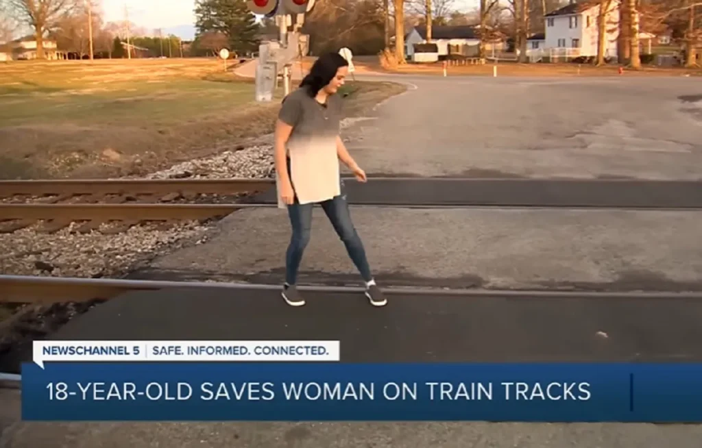 Tennessee railroad rescue, Heroic teen saves life, Elderly wheelchair rescue, Bravery on the tracks, Lifesaving quick actions, Train track heroism, Daring rescue story, Youth saves elderly, Real-life hero tale, Emergency rescue bravery, elderly woman