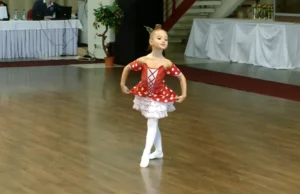 Chipollino Ballet Performance, Six-Year-Old Ballet Dancer, Anastasia Ballet Video, Children's Ballet Performance, Vibrant Ballet Costumes, Young Ballet Stars, Heartwarming Ballet Performances, Red and White Polka Dot Dress Ballet, Captivating Dance Videos, Playful Ballet Characters