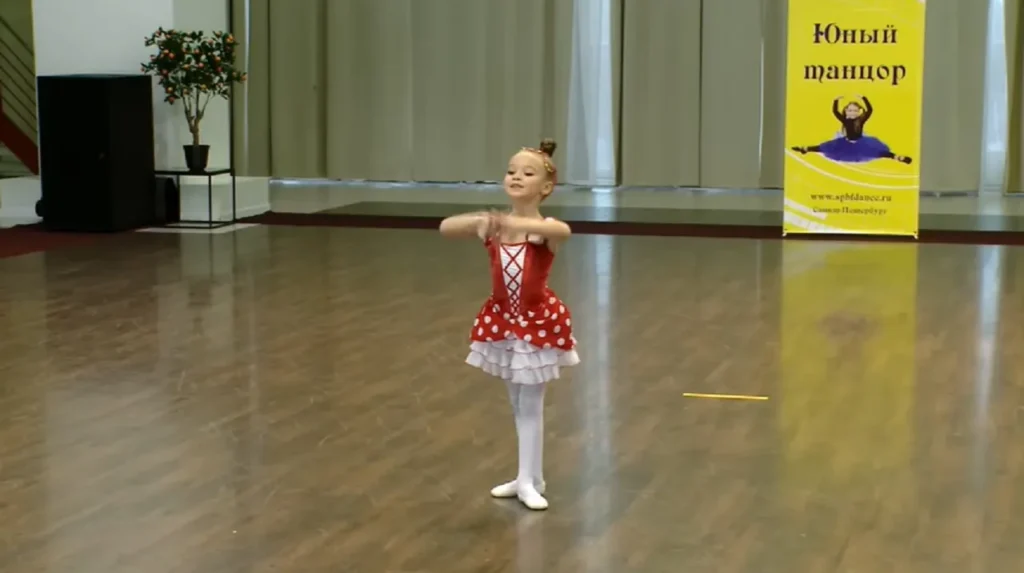 Chipollino Ballet Performance, Six-Year-Old Ballet Dancer, Anastasia Ballet Video, Children's Ballet Performance, Vibrant Ballet Costumes, Young Ballet Stars, Heartwarming Ballet Performances, Red and White Polka Dot Dress Ballet, Captivating Dance Videos, Playful Ballet Characters