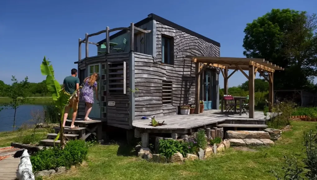 Sustainable tiny house, French tiny house living, Eco-friendly home design, Organic farm retreat, Reclaimed materials home, Tiny house luxury, Sustainable living ideas, Architectural ingenuity, Eco-conscious home decor, Tiny house inspiration