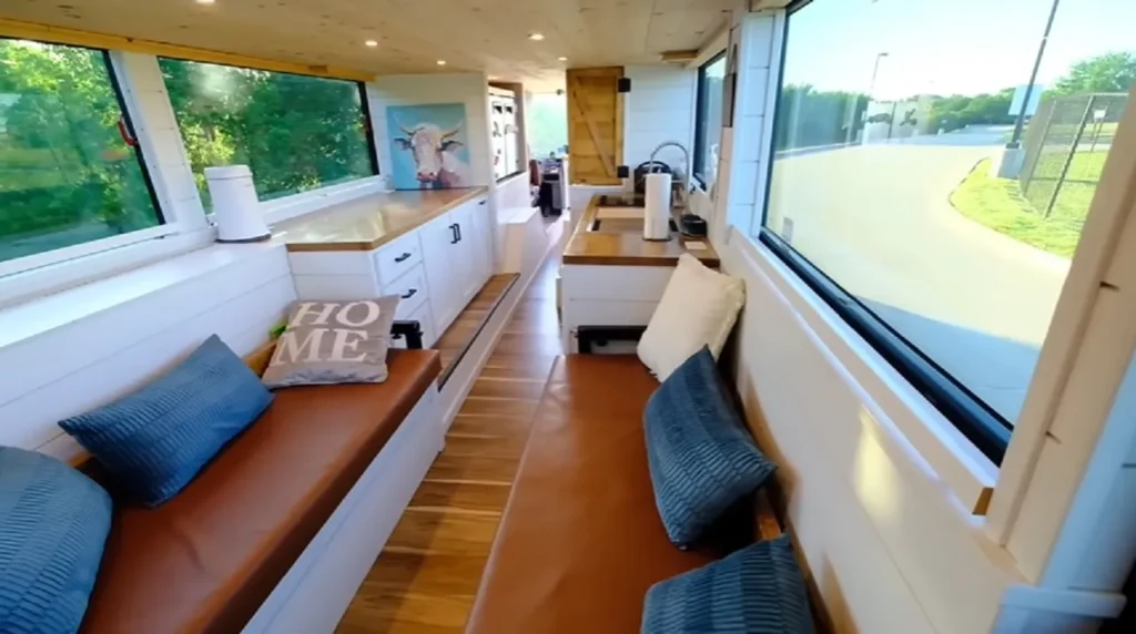 Double-decker bus tiny house, Tiny home transformation, Family bus conversion, Creative tiny living ideas, DIY bus home renovation, Alternative living spaces, Tiny house movement, Bus to home conversion, Unique tiny house ideas, Living in a converted bus