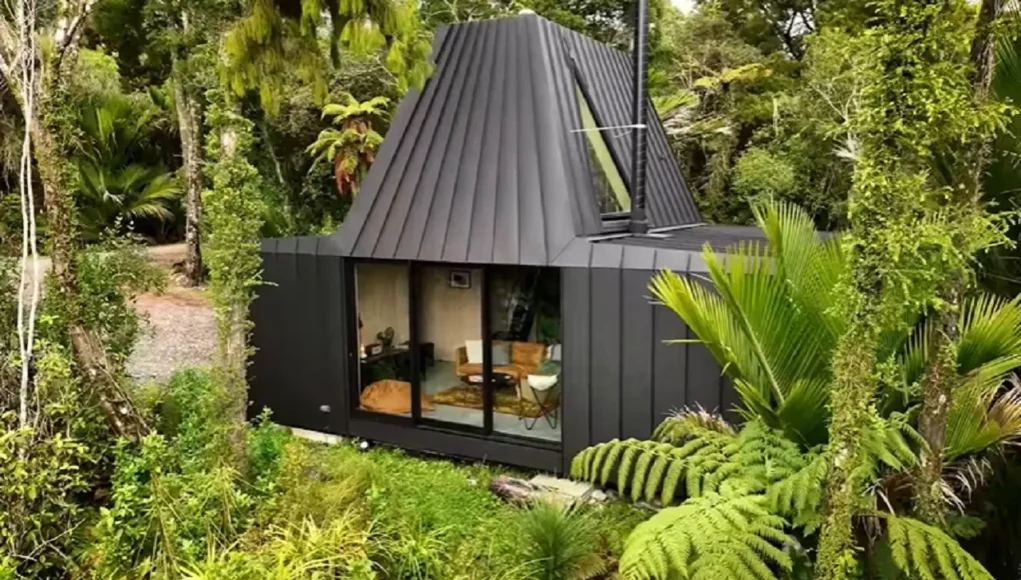 cabin living, modern cabin design, sustainable architecture, New Zealand cabin, minimalist retreat, tranquil living, compact space design, harmony with nature, purple heart Deccan, aluminum tray construction