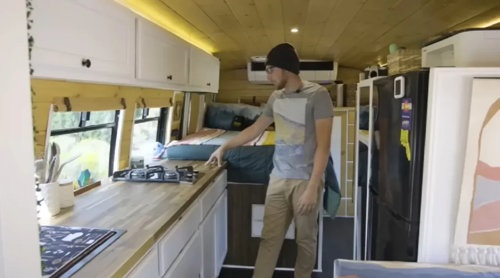 tiny home movement, DIY bus home, bus conversion, nomadic lifestyle, minimalist living, Franklin bus, shuttle bus transformation, sustainable living, mobile home, tiny living