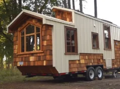 tiny house movement, handcrafted tiny house, modern aesthetics, downsizing benefits, sustainable living, tiny home craftsmanship, functional design, cozy tiny home, space-saving solutions, traditional warmth