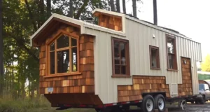 tiny house movement, handcrafted tiny house, modern aesthetics, downsizing benefits, sustainable living, tiny home craftsmanship, functional design, cozy tiny home, space-saving solutions, traditional warmth