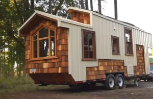 tiny house movement, handcrafted tiny house, modern aesthetics, downsizing benefits, sustainable living, tiny home craftsmanship, functional design, cozy tiny home, space-saving solutions, traditional warmth