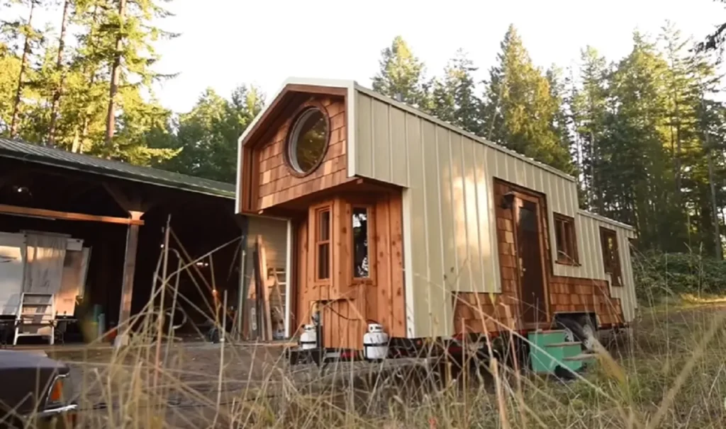 tiny house movement, handcrafted tiny house, modern aesthetics, downsizing benefits, sustainable living, tiny home craftsmanship, functional design, cozy tiny home, space-saving solutions, traditional warmth