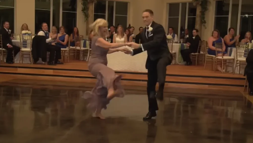 wedding dance, mother-son dance, Houston wedding, creative wedding moments, choreographed dance, wedding entertainment, wedding humor, family bond, unique wedding ideas, unforgettable wedding