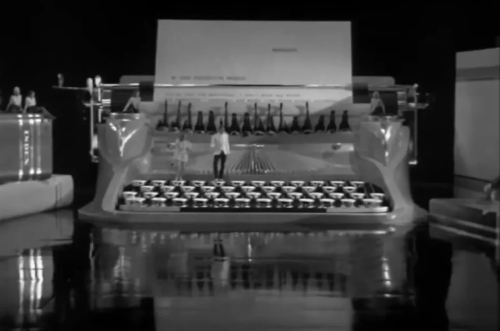 Ruby Keeler tap dance, Lee Dixon typewriter dance, 1937 Hollywood dance scene, iconic tap routines, Ready Willing and Able dance, classic film tap dance, giant typewriter dance, Bobby Connolly choreography, Golden Age of Hollywood dance, Ruby Keeler Lee Dixon