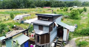 off-grid tiny house, sustainable tiny living, salvaged material home, eco-friendly tiny home, minimalist home design, mobile tiny house, permaculture tiny house, tiny house on wheels, alternative living solutions, sustainable off-grid lifestyle