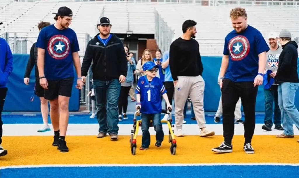 Boise State Broncos recruit, Team IMPACT, 6-year-old football recruit, inspiring sports stories, inclusivity in sports, child with leukodystrophy
